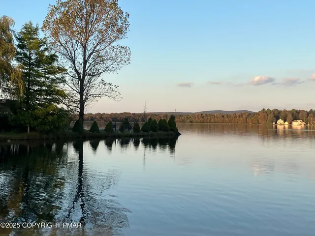 a front view of a house with backyard