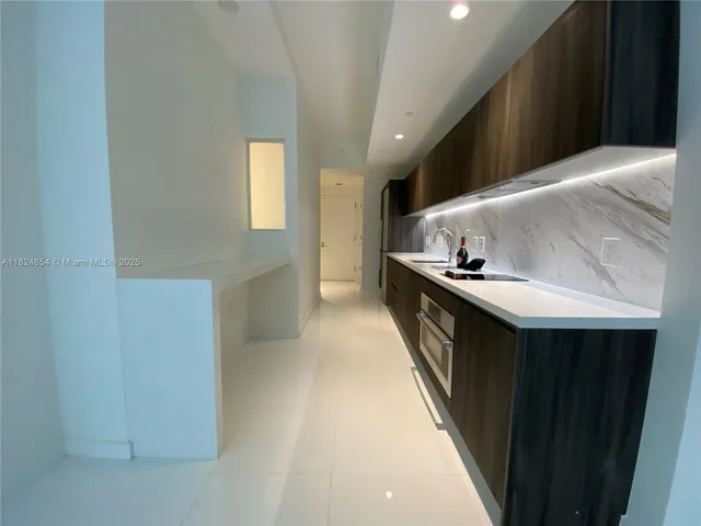 a hallway with cabinets
