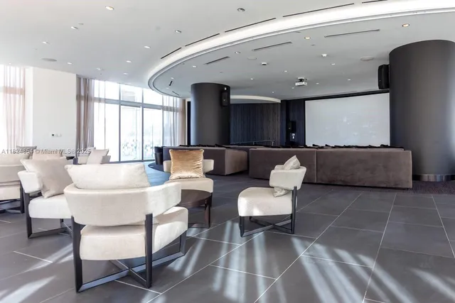 a view of a building with garden and sitting area