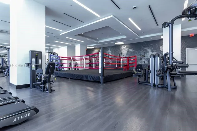 a view of a porch with wooden floor and furniture