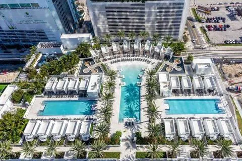 a bathroom with glass door shower and a glass door