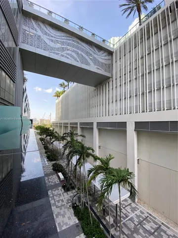 a view of building and yard with swimming pool