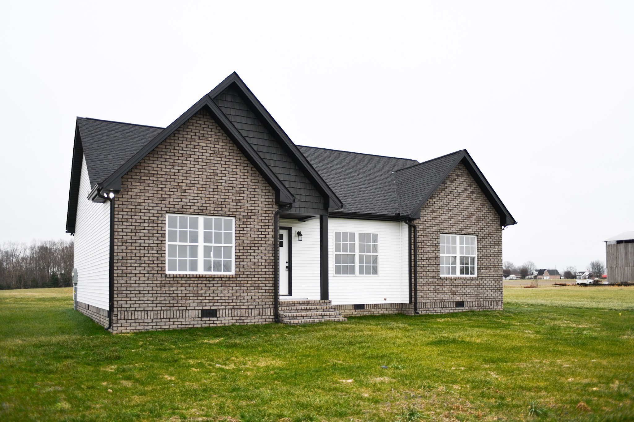 1199 Coleytown Road Lafayette, TN 37083 - Photo 1 of 23 a front view of a house with a garden