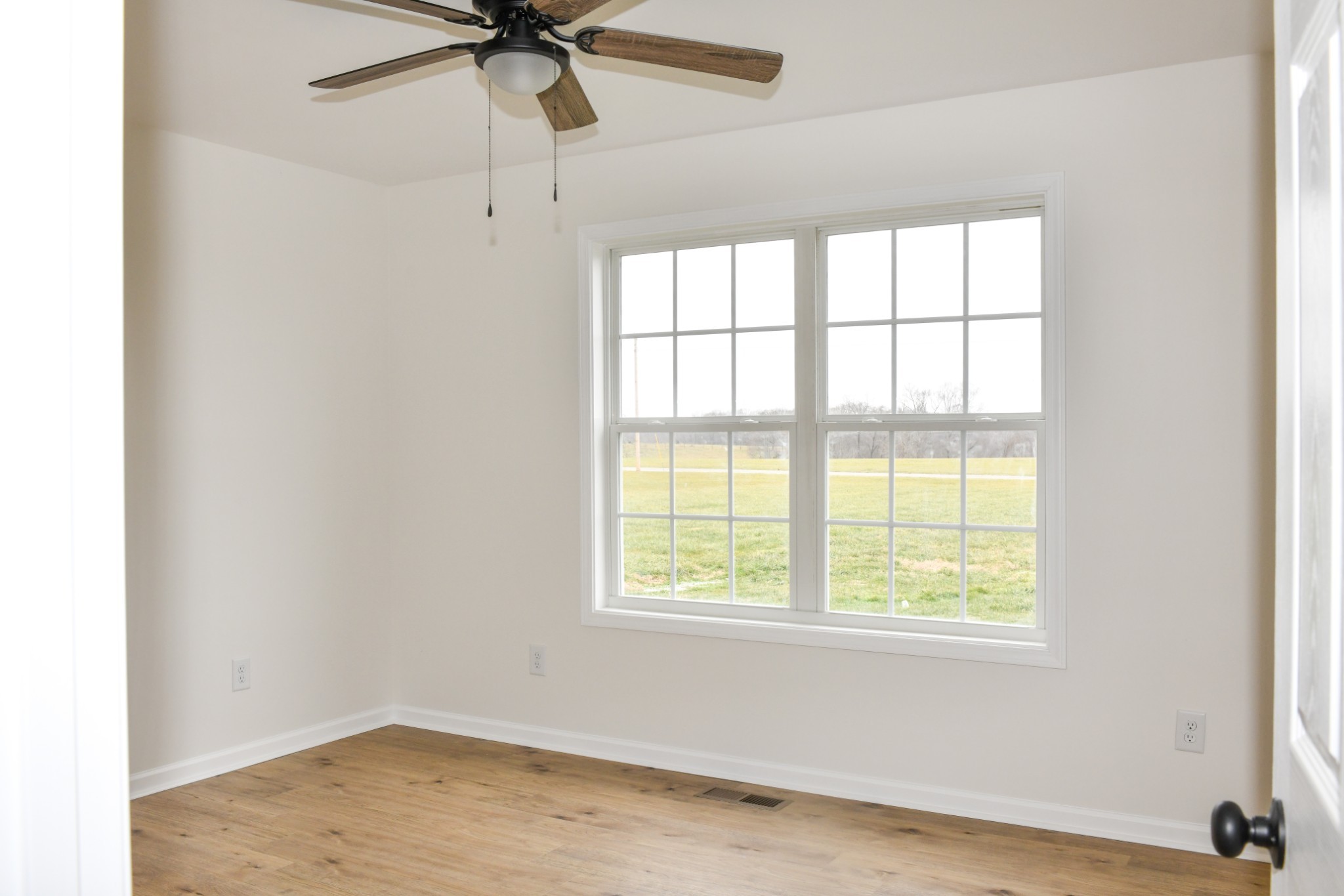 1199 Coleytown Road Lafayette, TN 37083 - Photo 17 of 23 an empty room with a window and a ceiling fan