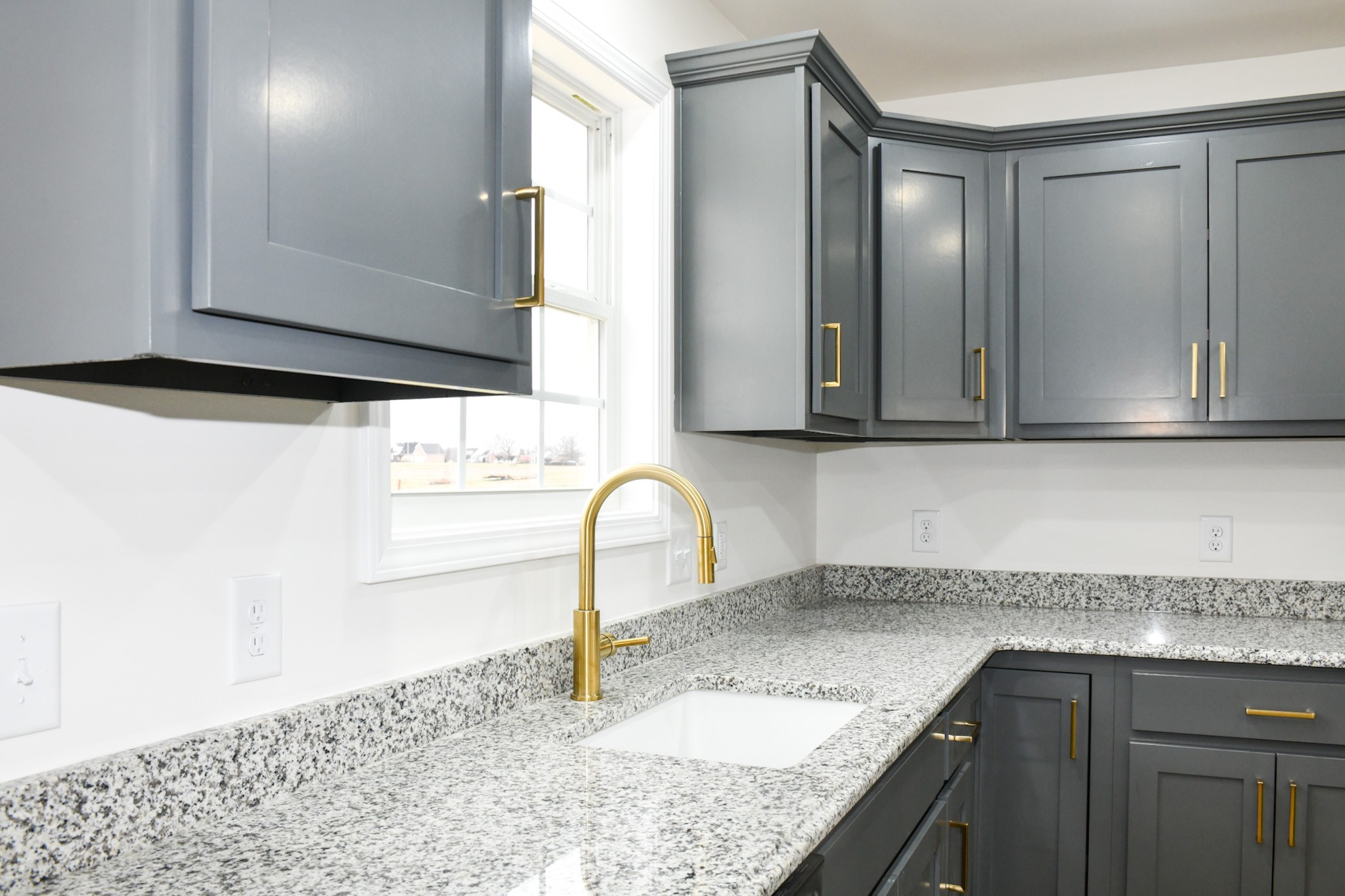 1199 Coleytown Road Lafayette, TN 37083 - Photo 6 of 23 a kitchen with granite countertop a sink and a stove