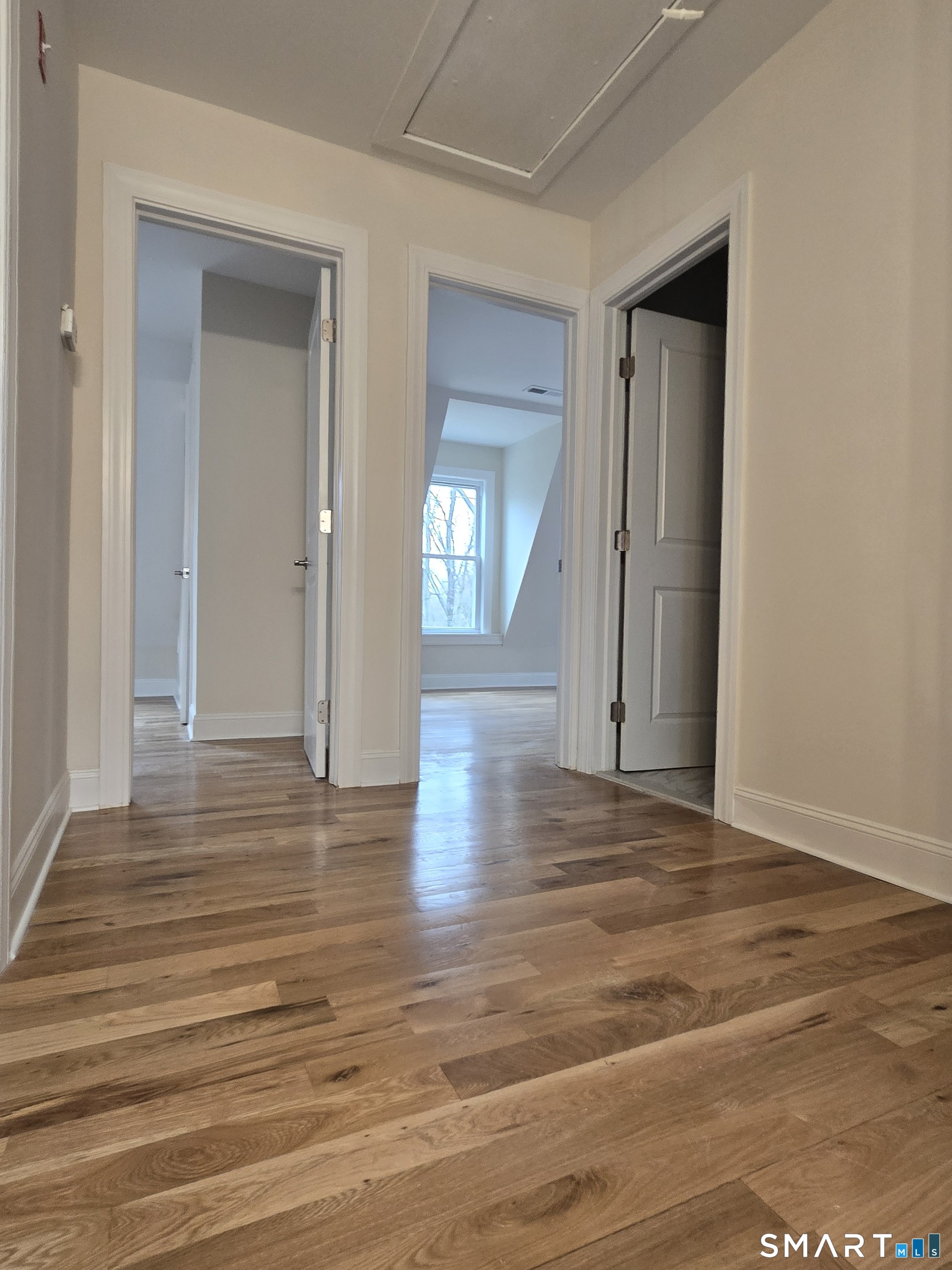 8 Pine Street Norwich, CT 06360 - Photo 16 of 27 a view of a hallway with wooden floor