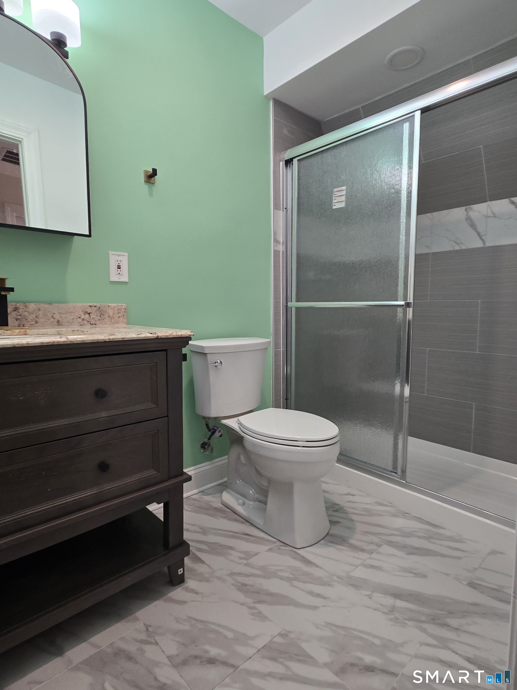 8 Pine Street Norwich, CT 06360 - Photo 17 of 27 a bathroom with a toilet and a sink