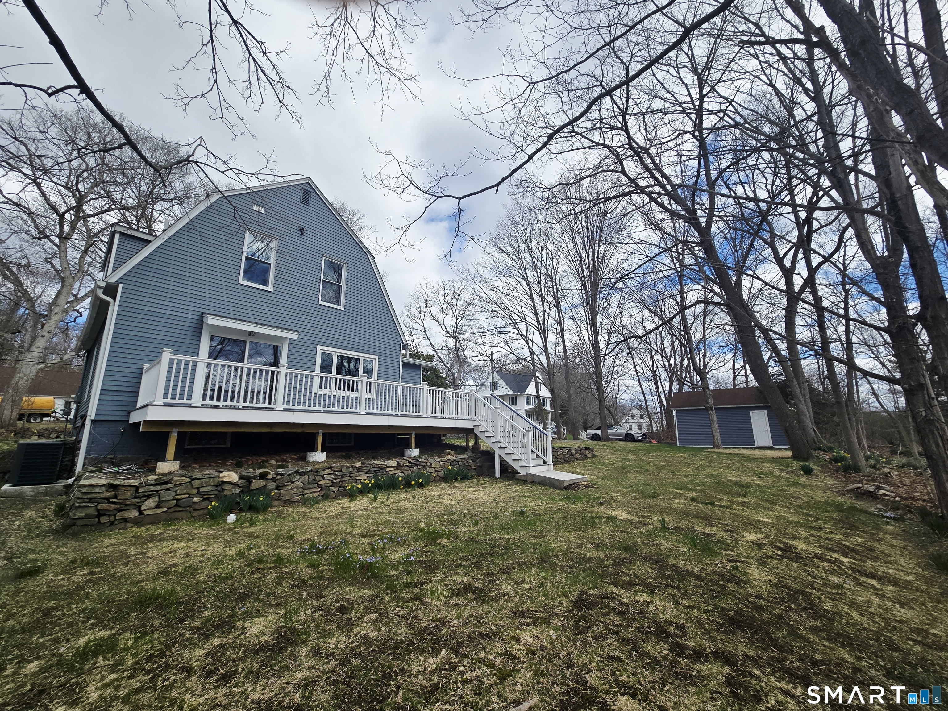 8 Pine Street Norwich, CT 06360 - Photo 7 of 27 a house that has a tree in front of it