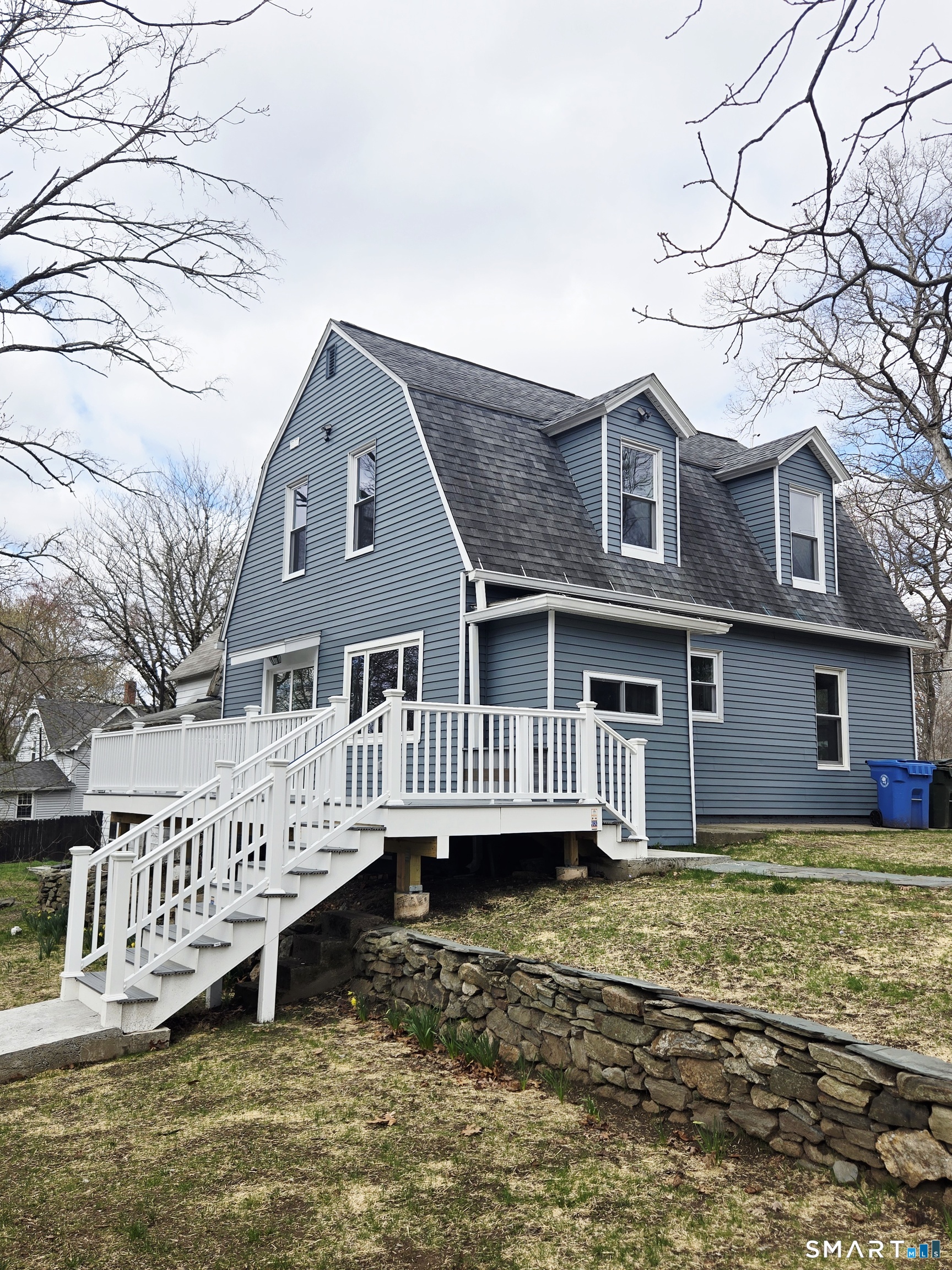 8 Pine Street Norwich, CT 06360 - Photo 9 of 27 a view of a house with a wooden deck