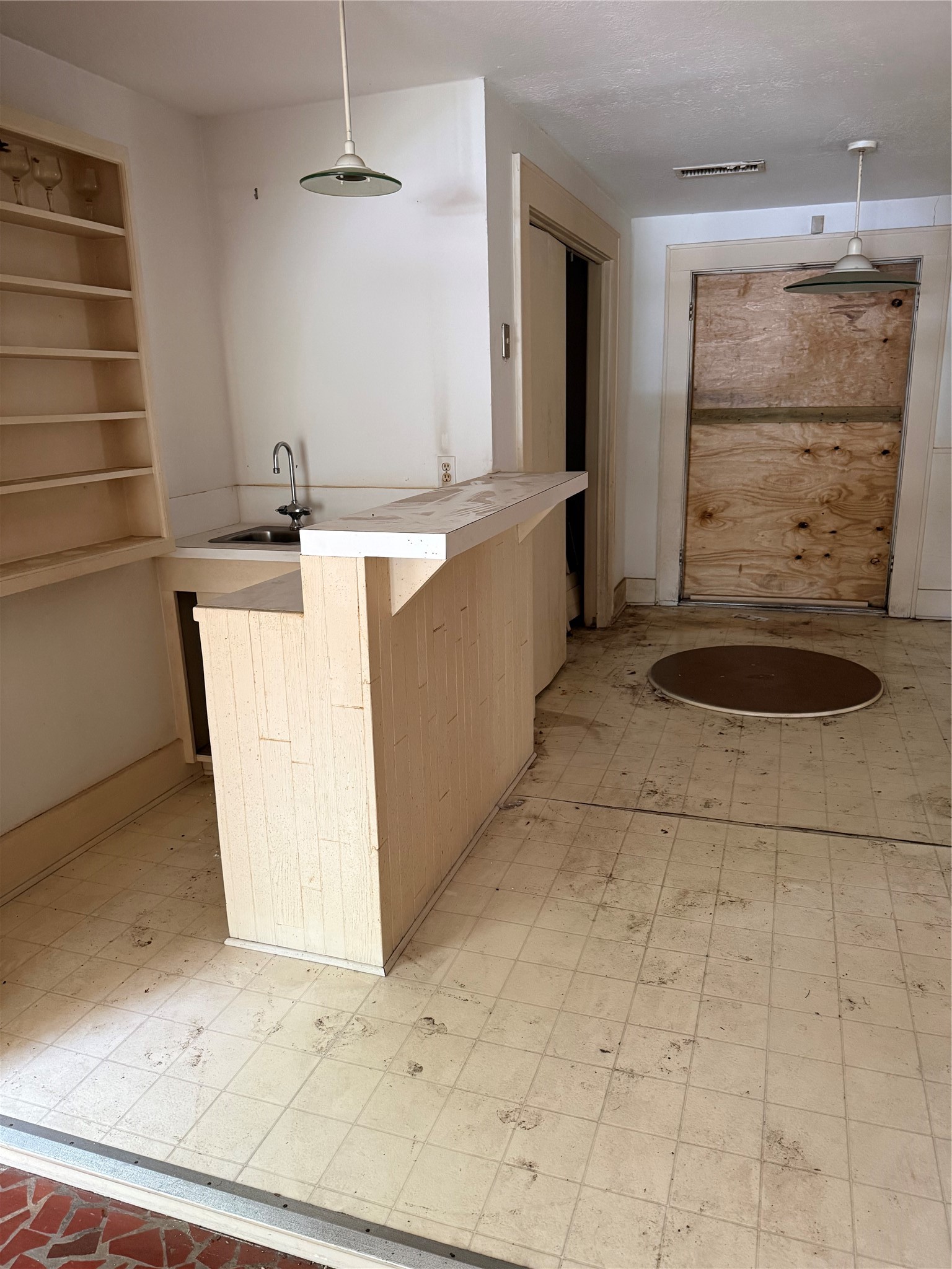 2139 Quenby Street Houston, TX 77005 - Photo 8 of 14 Bar area, note door and floor damage