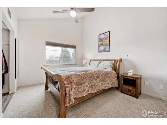 a bathroom with a granite countertop sink a toilet a mirror a bathtub and shower