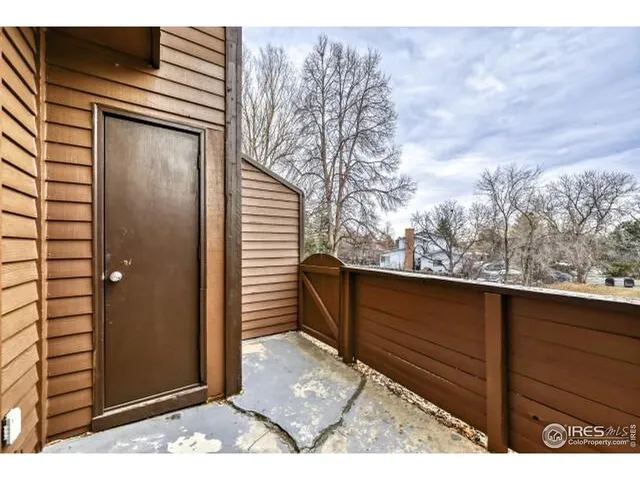 a view of a house with a door and wooden floor
