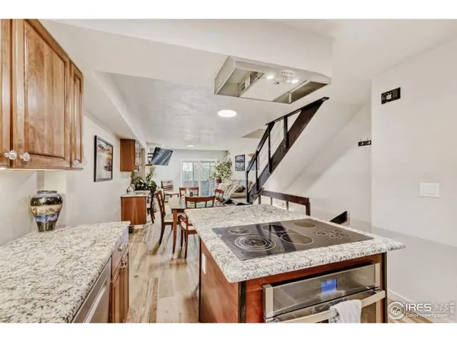a kitchen that has a table and chairs in it
