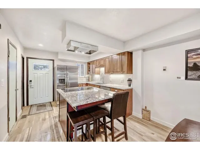 a open kitchen with a table and chairs in it