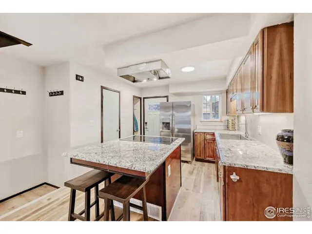 a view of a dining room with furniture and a potted plant