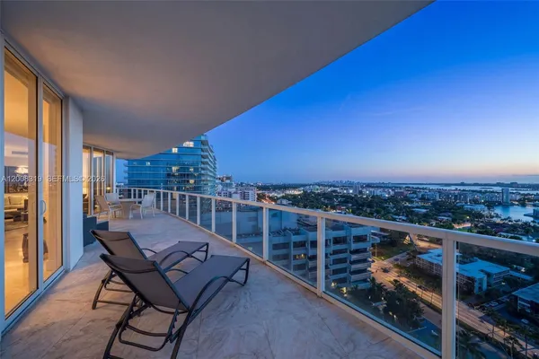 a view of a balcony with an ocean view