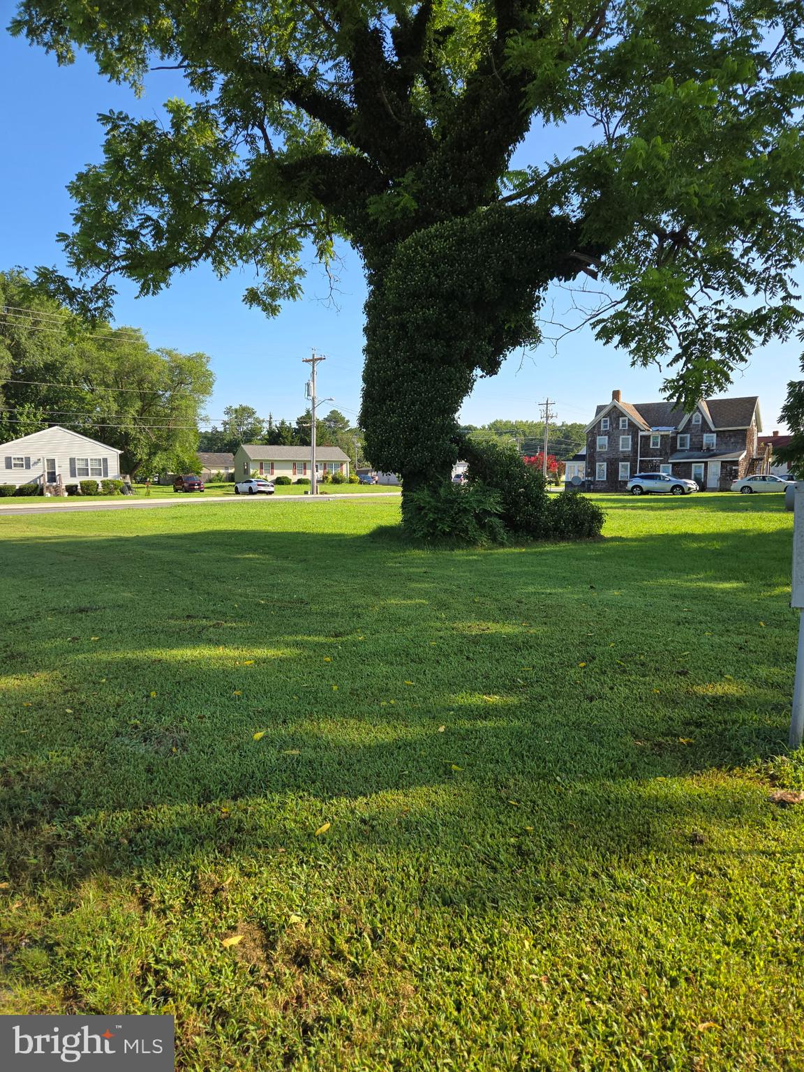 210 Flower Street Berlin, MD 21811 - Photo 2 of 9 a view of a golf course with a garden