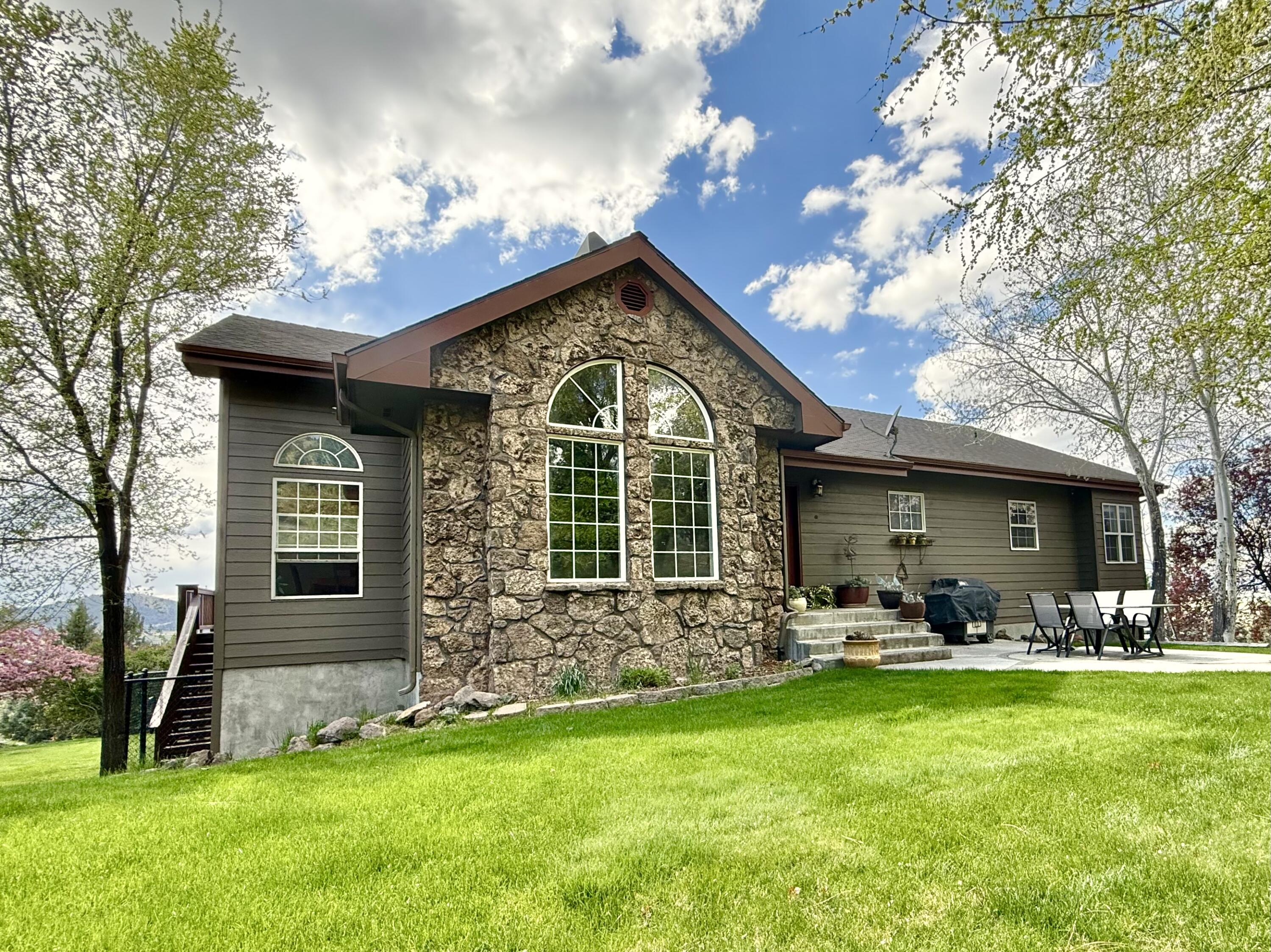 13351 Crystal Springs Road Klamath Falls, OR 97603 - Photo 1 of 51 a front view of a house with garden