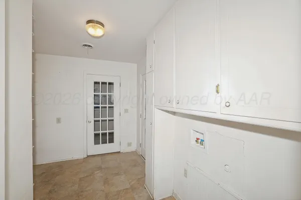 a view of empty room with windows