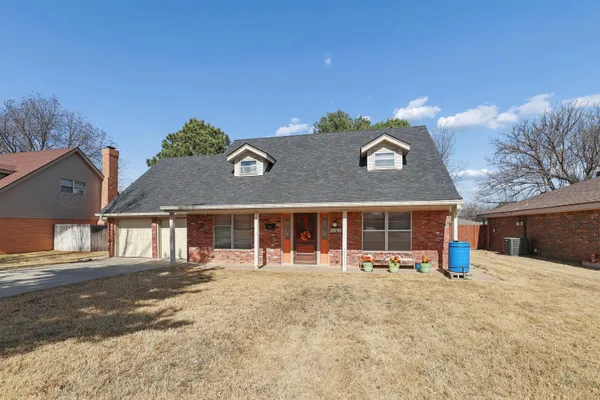 front view of a house with a view of outdoor space