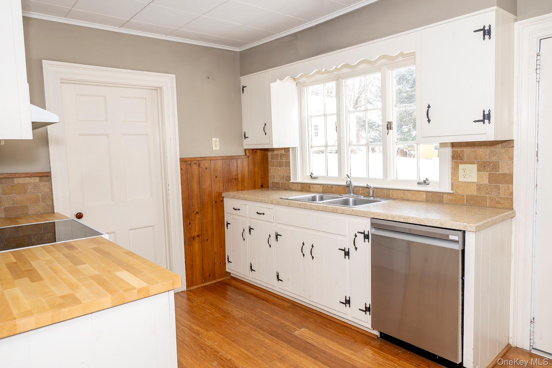 79 Camby Road Millbrook, NY 12545 - Photo 15 of 34 a kitchen with granite countertop white cabinets and white appliances