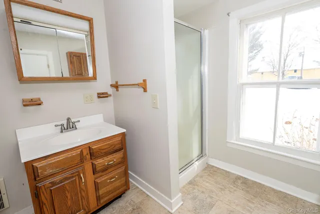 a bathroom with a sink a vanity and a mirror