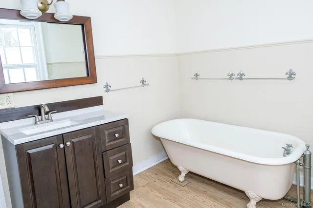 a bathroom with a bathtub and a sink