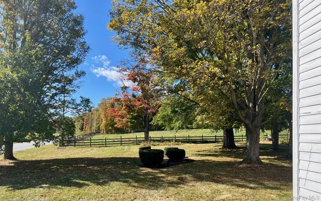a view of a water fountain in a backyard
