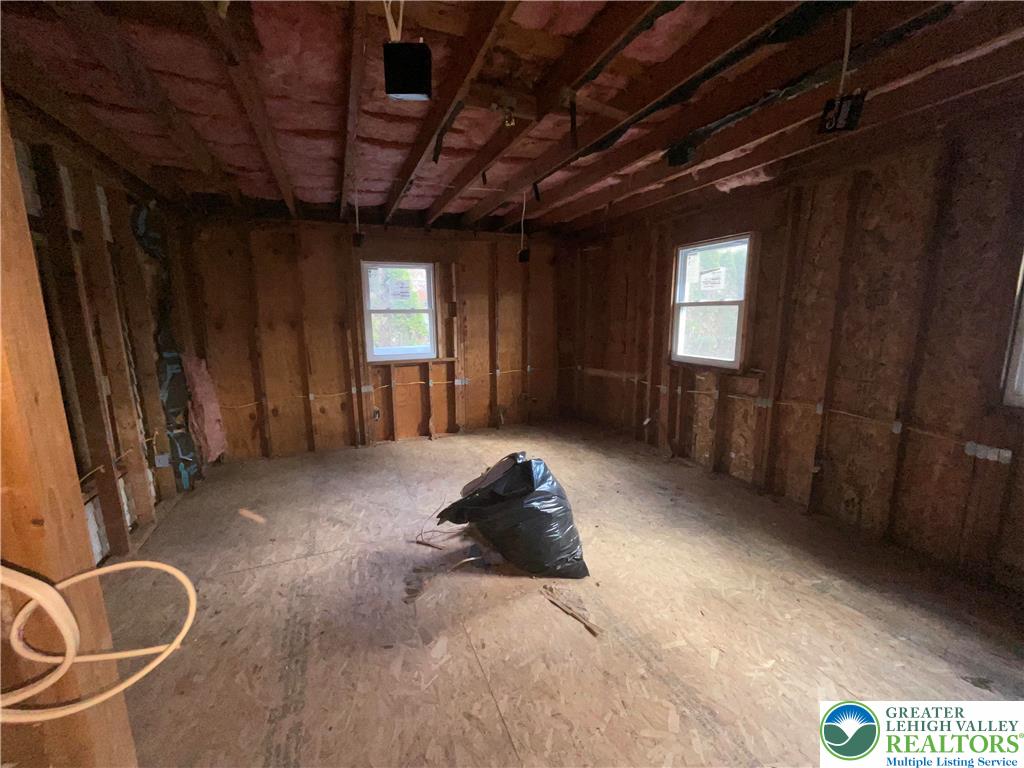 265 Mill Road Lehighton, PA 18235 - Photo 21 of 29 a bedroom with a bed and a chandelier