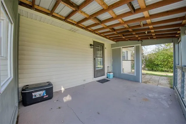 a view of a room with wooden walls and roof