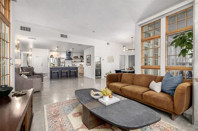 a living room with furniture and a table