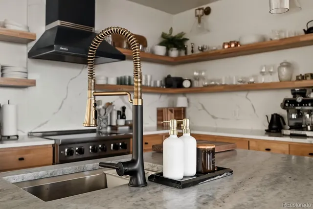 a dining room with furniture a chandelier and window