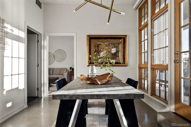 a bedroom with a large bed and a large window