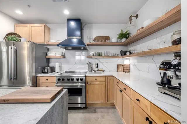 a kitchen with a sink and white cabinets