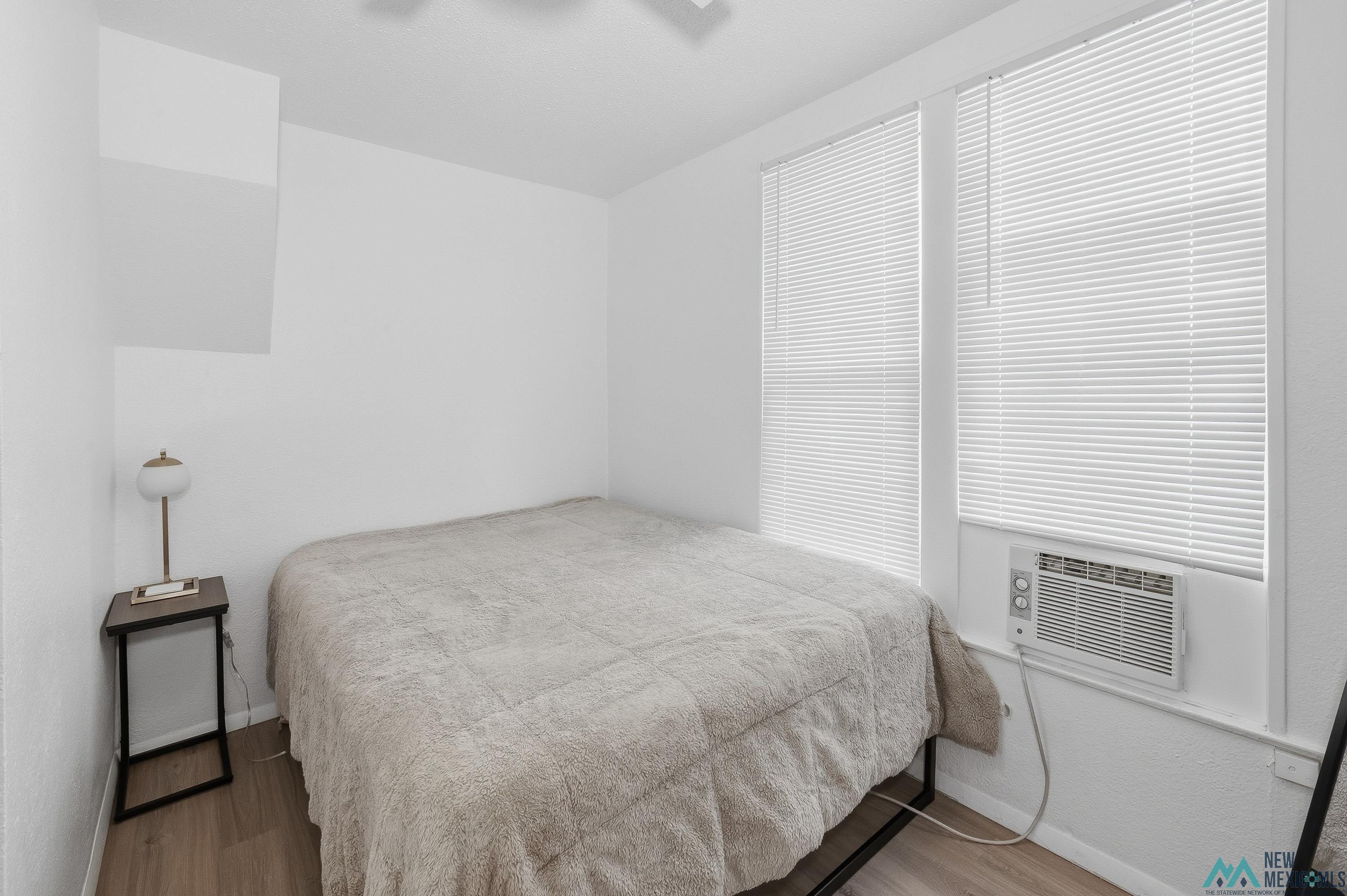 120 South 5th Street Raton, NM 87740 - Photo 14 of 25 Bedroom featuring wood finished floors and baseboards