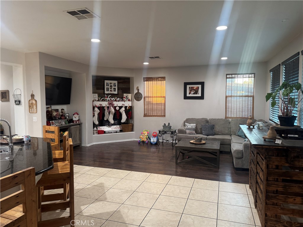 4300 Cloudywing Road Hemet, CA 92545 - Photo 12 of 29 a living room with furniture and a flat screen tv