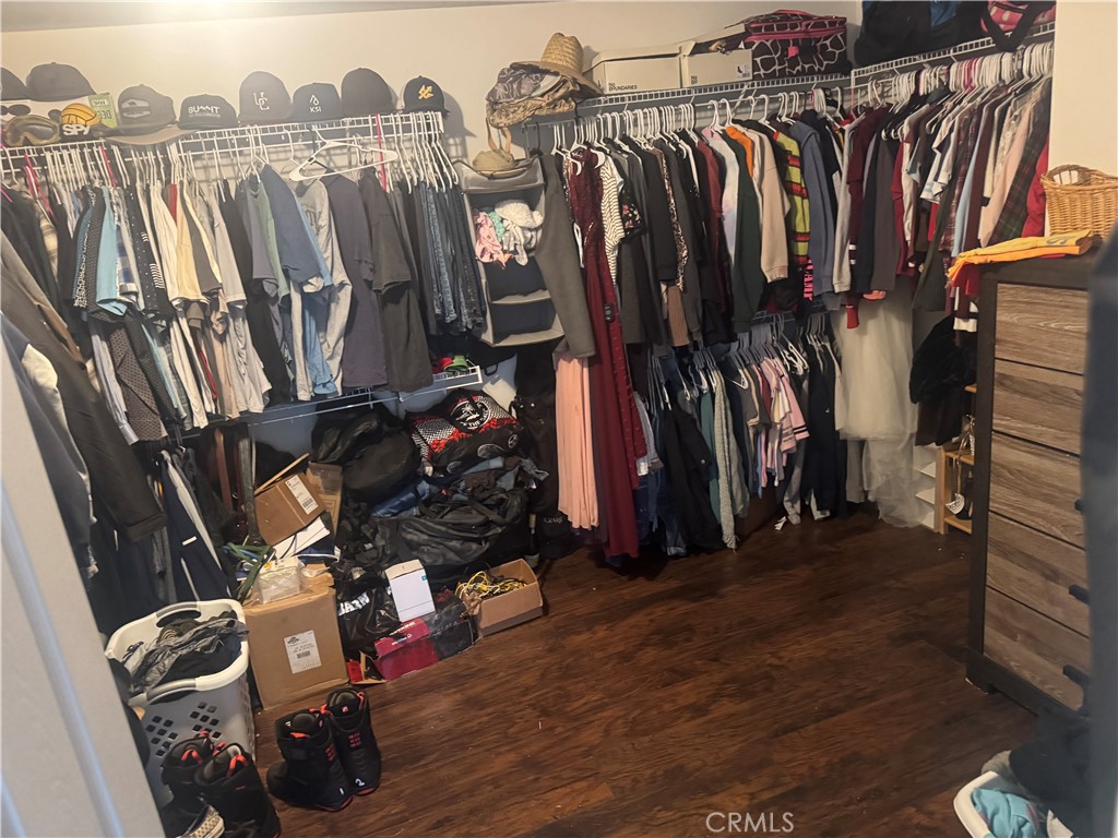 4300 Cloudywing Road Hemet, CA 92545 - Photo 21 of 29 a view of walk in closet with clothes and shoes