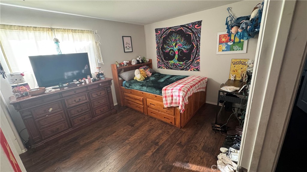 4300 Cloudywing Road Hemet, CA 92545 - Photo 23 of 29 a bedroom with furniture and a window