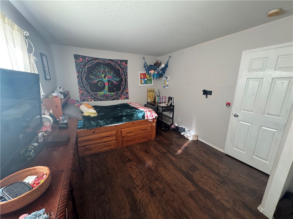 4300 Cloudywing Road Hemet, CA 92545 - Photo 24 of 29 a living room with furniture and wooden floor