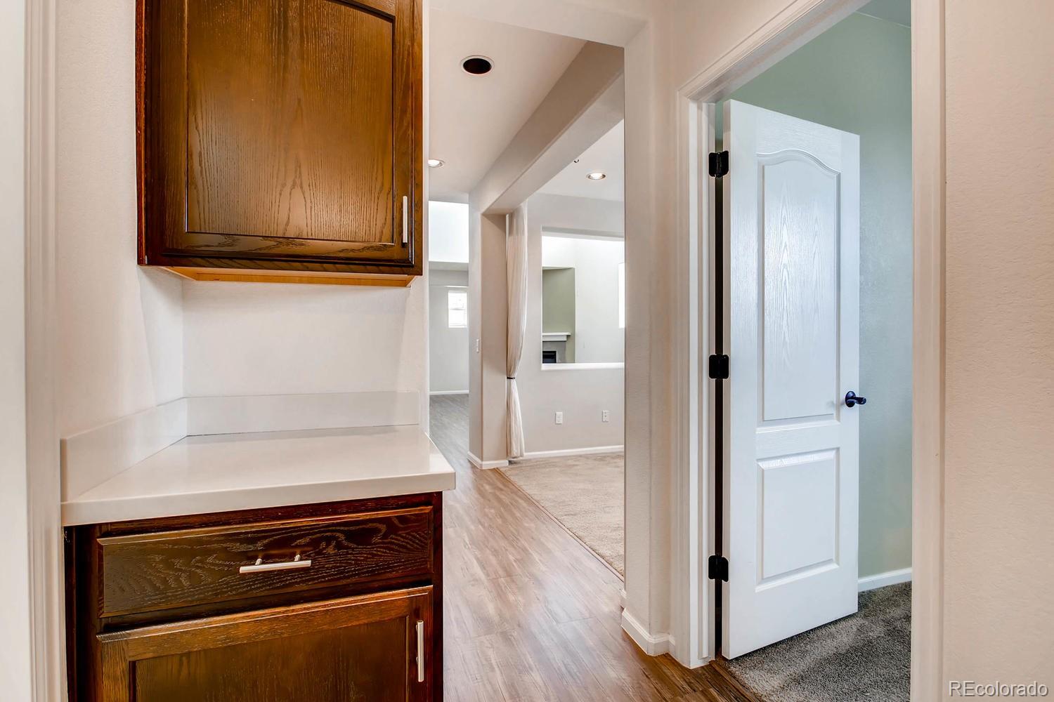 9511 Loggia Street, Unit C Highlands Ranch, CO 80126 - Photo 14 of 32 a view of a kitchen with wooden floor