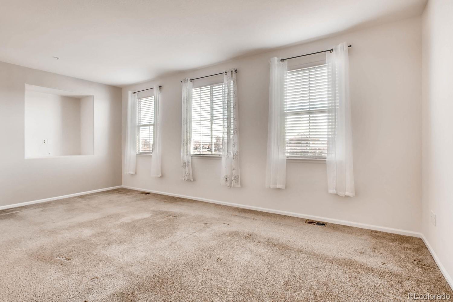 9511 Loggia Street, Unit C Highlands Ranch, CO 80126 - Photo 19 of 32 an empty room with windows