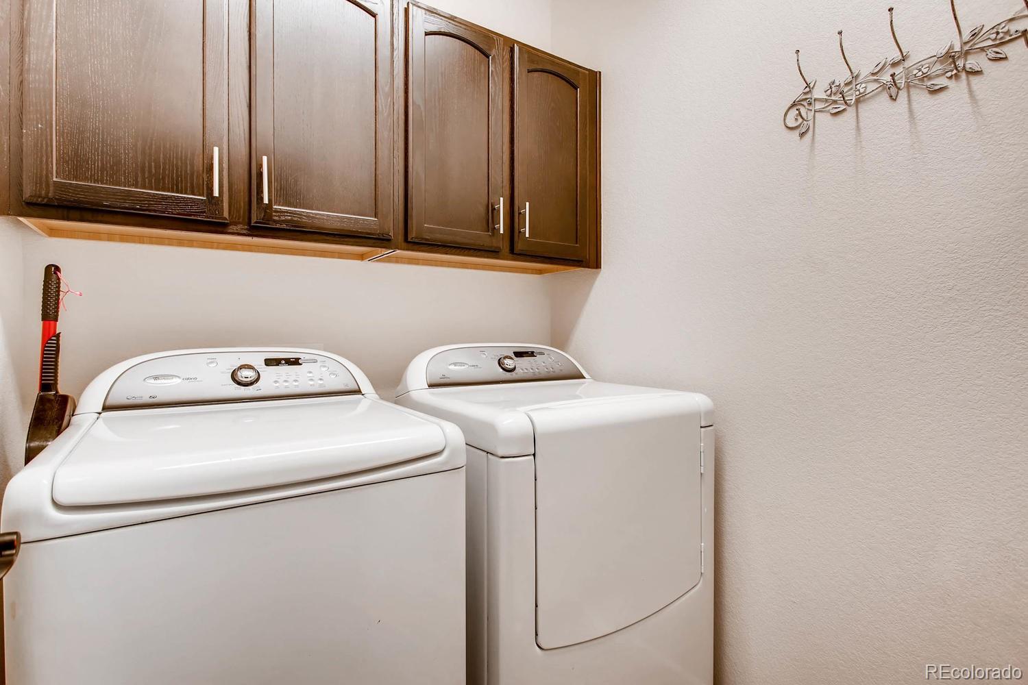 9511 Loggia Street, Unit C Highlands Ranch, CO 80126 - Photo 24 of 32 a utility room with dryer and washer