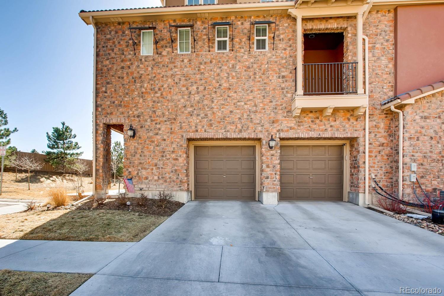 9511 Loggia Street, Unit C Highlands Ranch, CO 80126 - Photo 27 of 32 front view of a house with a yard