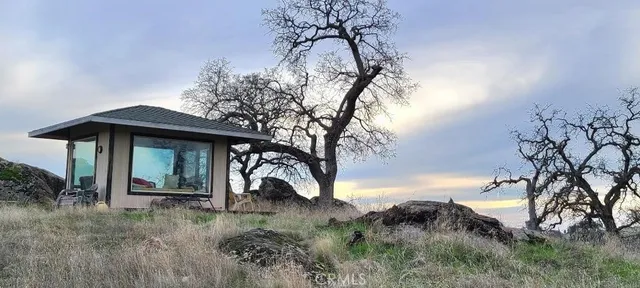 a big yard with flowing stream of water in middle