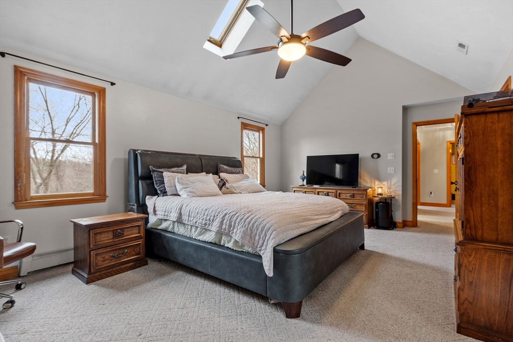 76 Woobly Road Bolton, MA 01740 - Photo 14 of 27 a bedroom with a bed chandelier and a window