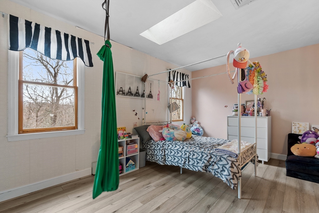 76 Woobly Road Bolton, MA 01740 - Photo 15 of 27 a bedroom with furniture and a window