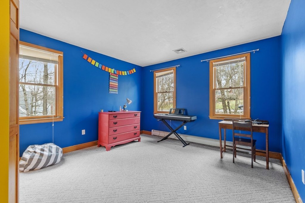 76 Woobly Road Bolton, MA 01740 - Photo 16 of 27 a living room with furniture and a window