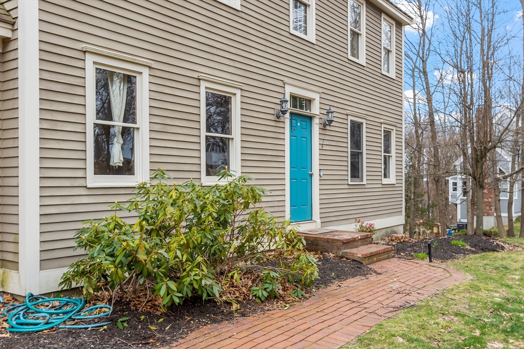 76 Woobly Road Bolton, MA 01740 - Photo 2 of 27 a view of a house with a yard and a garden
