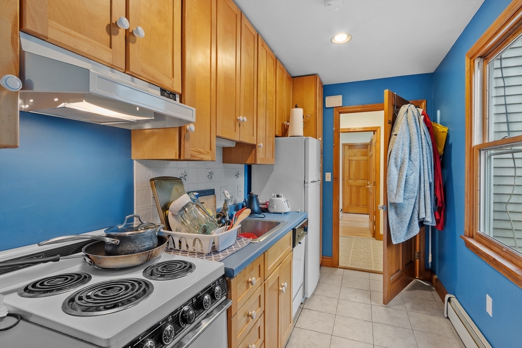 76 Woobly Road Bolton, MA 01740 - Photo 21 of 27 a kitchen with a stove and a refrigerator