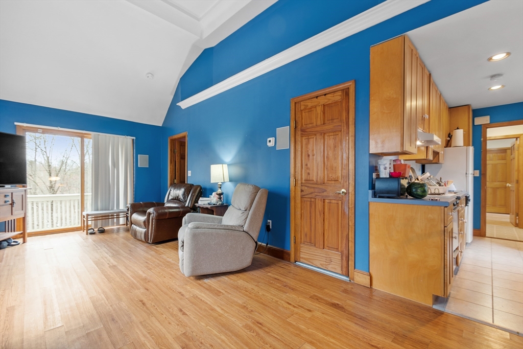 76 Woobly Road Bolton, MA 01740 - Photo 22 of 27 a living room with furniture and a large window